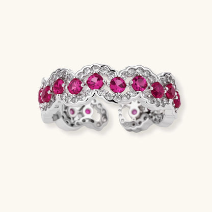 Ornate adjustable ring with pink cubic zirconia stones in white gold-plated copper setting with floral metalwork details