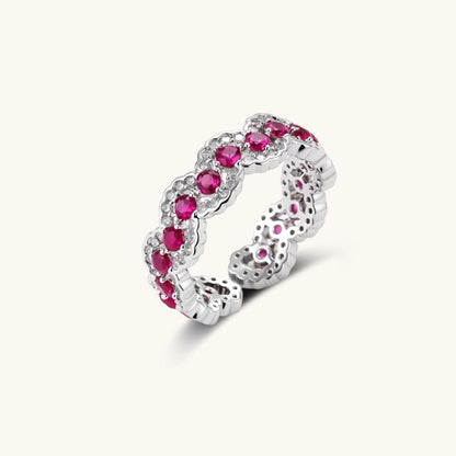Ornate adjustable ring with pink cubic zirconia stones in white gold-plated copper setting with floral metalwork details
