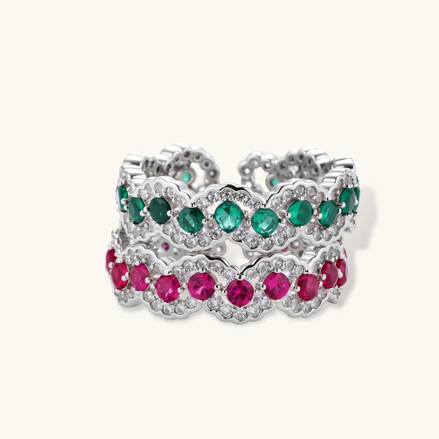 Platinum-plated copper ring with green zirconia stones in decorative scalloped wave pattern, adjustable band design.